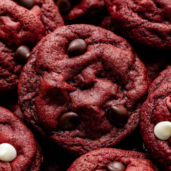 Close-up of red velvet cookies with chocolate chips and white chocolate chips.
